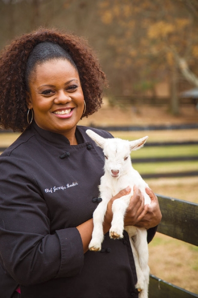 Jennifer Hill Booker holding a baby goat